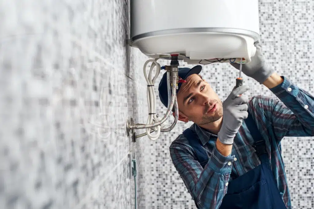 Technician servicing tankless water heater
