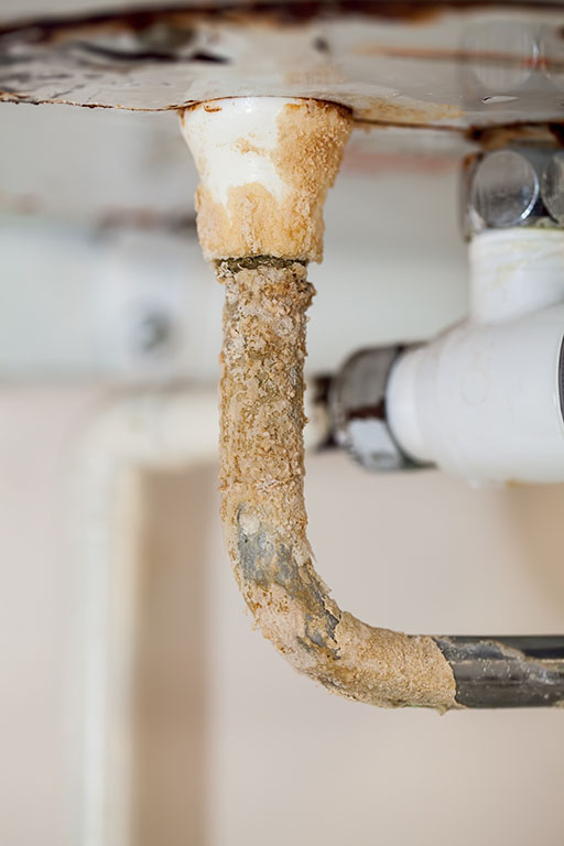 scale buildup on plumbing pipe