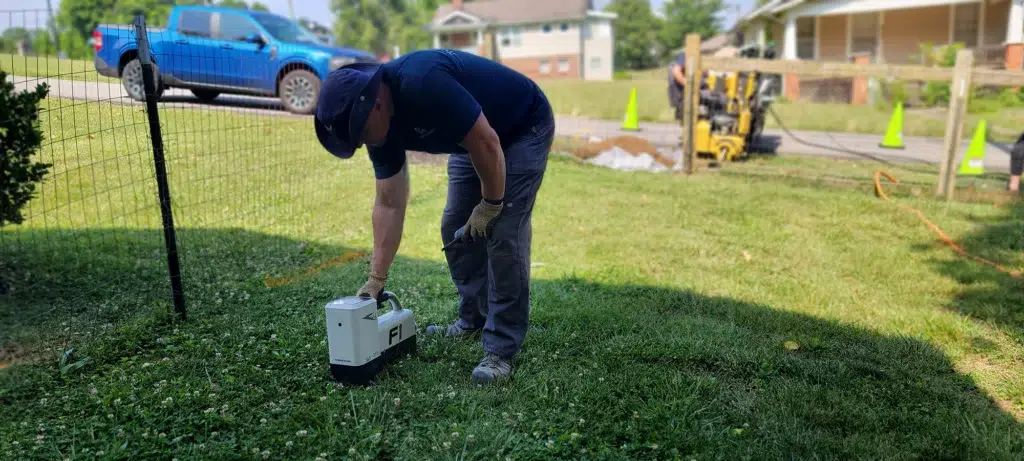 Technician using cable splicing tool in Knoxville, TN.