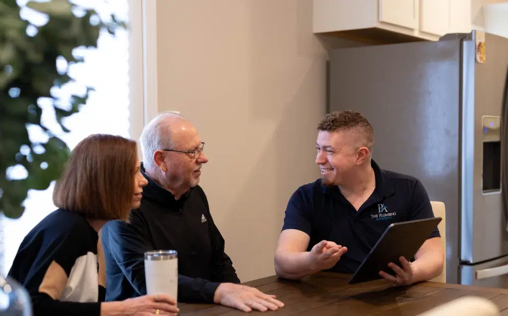 Technician smiling helping customers in Knoxville, TN.