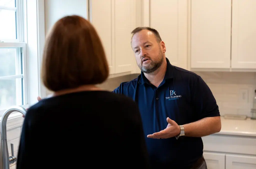 Technician helping customer in residential home in Knoxville, TN.