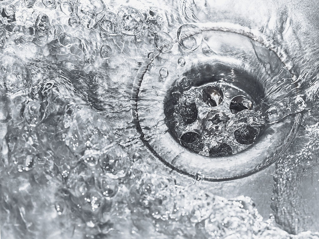 water draining down a kitchen sink