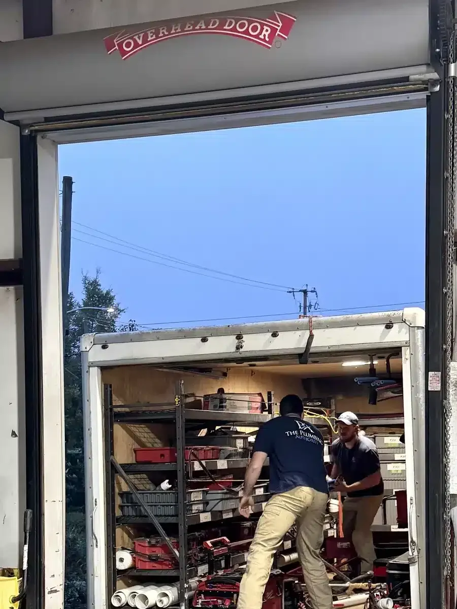 Employee organizing tools inside the work truck at the start of a Winning Wednesday task