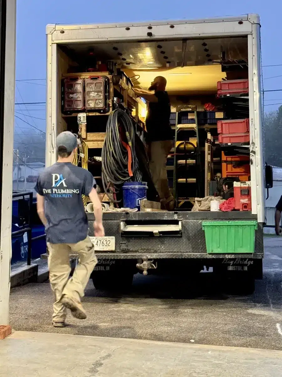 Team setting up materials inside the work truck for a Winning Wednesday competition