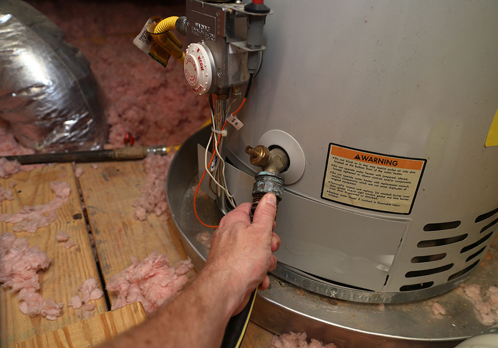 The Plumbing Authority technician performing water heater service in knoxville